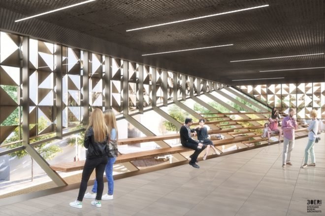 people sitting on wood stair-like benches inside room with glass walls covered partially by aluminum triangles
