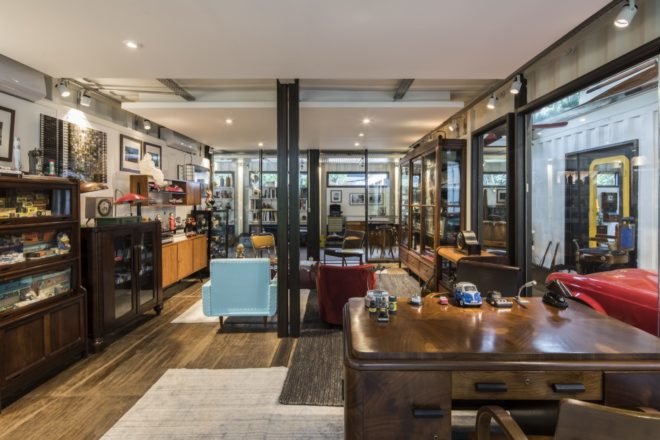 vintage-era desks and hutches filled with art