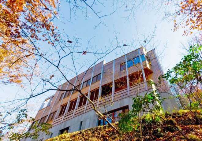 view from ground of timber multi-story home