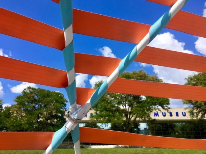 close-up of red seat belts attached to the dome