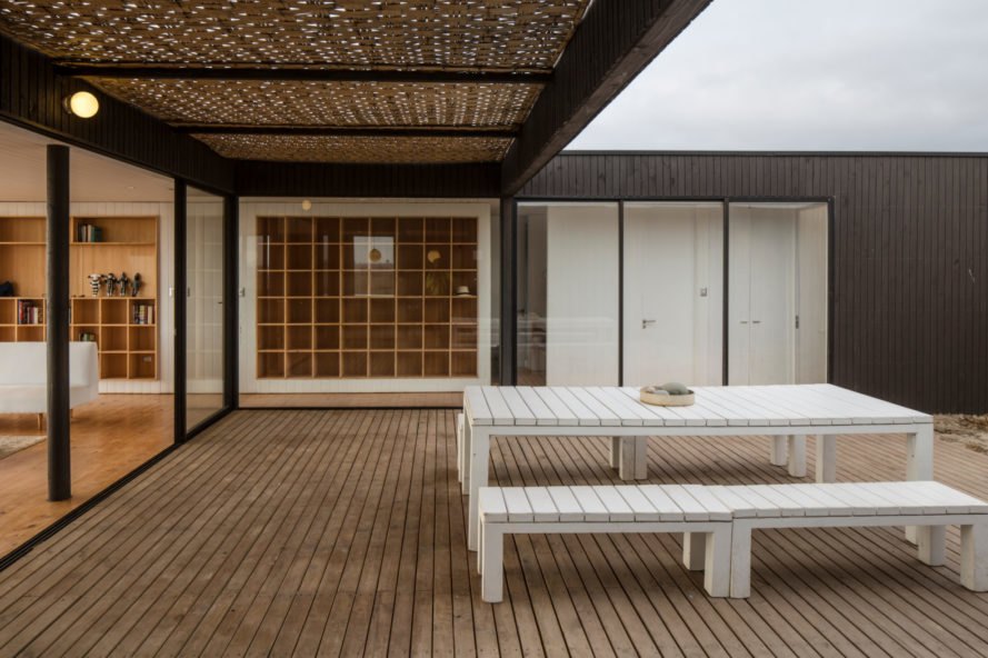 a courtyard with two lounge chairs