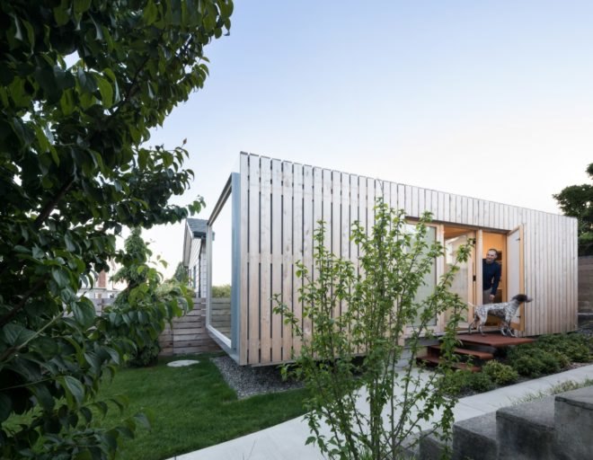 shipping container clad in thin wood slats