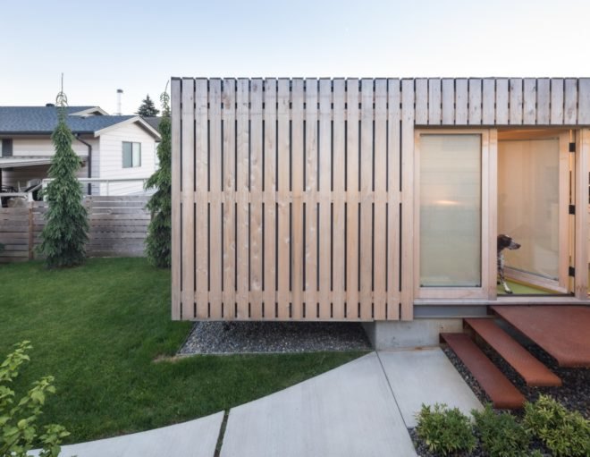 shipping container clad in thin wood slats