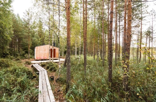 a wooden pathway leading up to a cabin