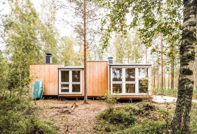 wooden cabin with large windows