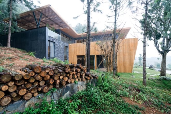 timber and stone home in a forest