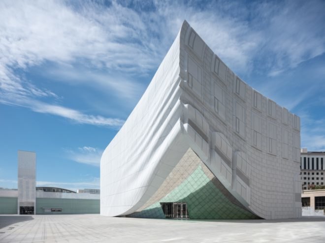 white building with warped corner
