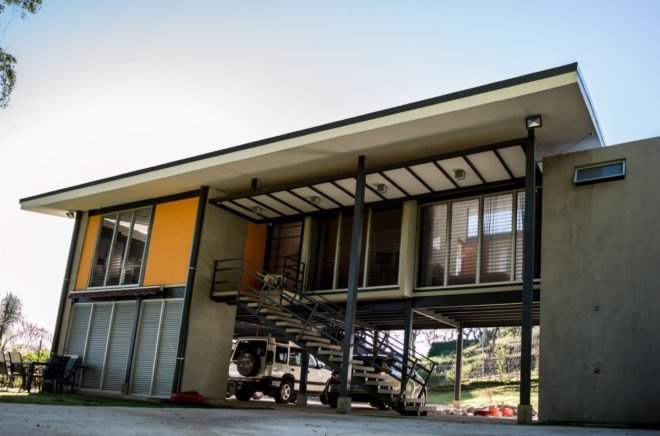 steps leading to front door of a home on stilts