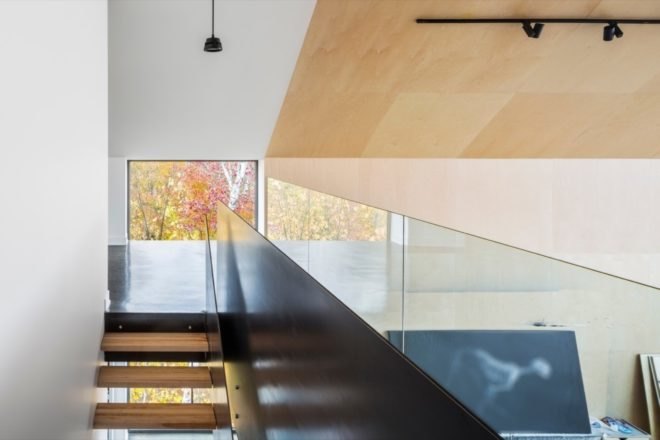 timber stairs and a glass separating wall