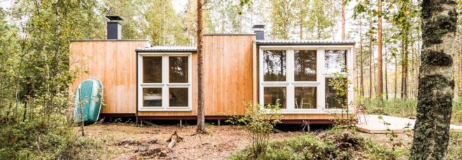 wooden cabin with large windows