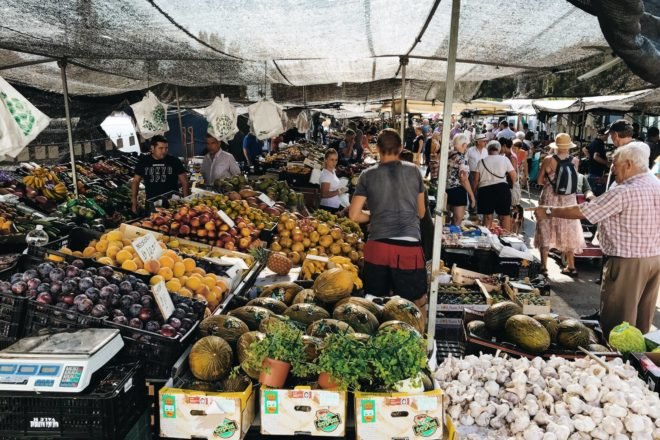 People walking around a farmers market