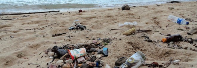 cropped close-up of plastic garbage on a beach in Indonesia
