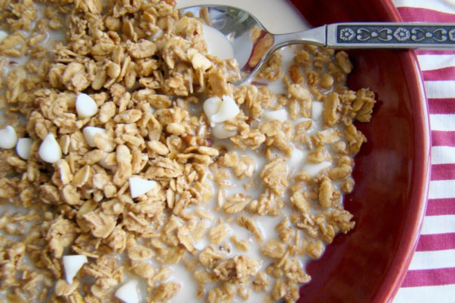 close up of bowl of granola with oat milk