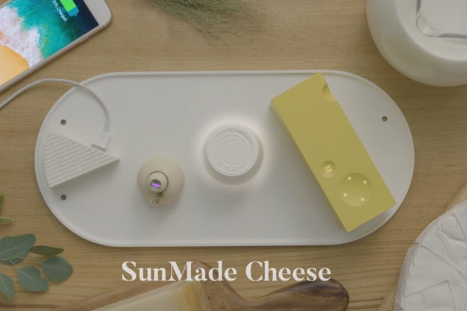 cheese-shaped chargers and accessories on a white, solar-powered plate