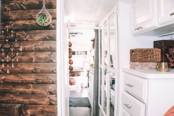 white storage space near a wood-paneled wall