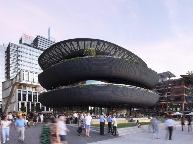 black timber building with three rounded levels