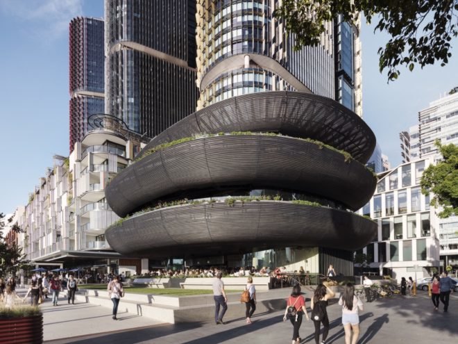 black rounded building on a street corner