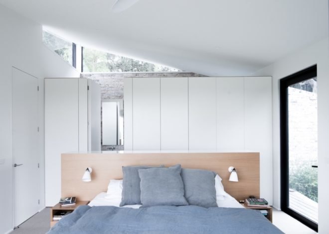 white bedroom with light gray bedding