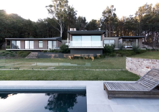 timber home with pool in foreground