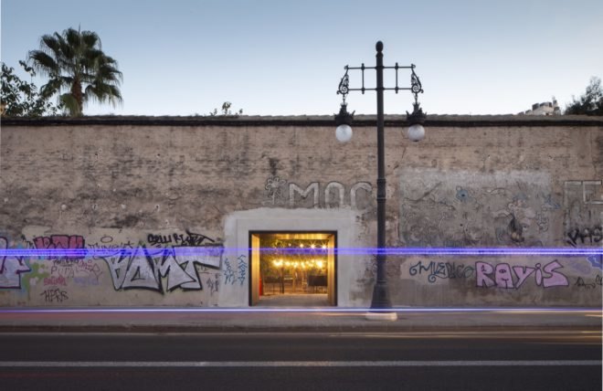 building with streetlamp and graffiti