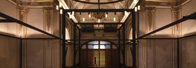 large church space with gold detailed ceilings and walls