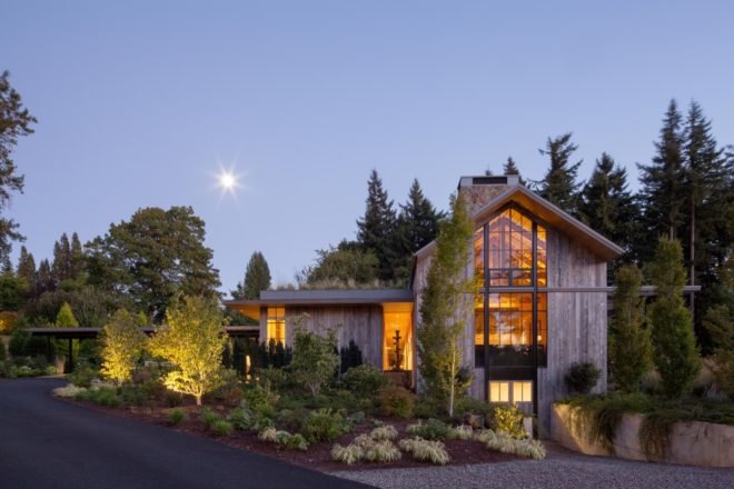 timber gabled home surrounded by plants