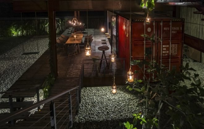 outdoor deck lit up with hanging lights at night