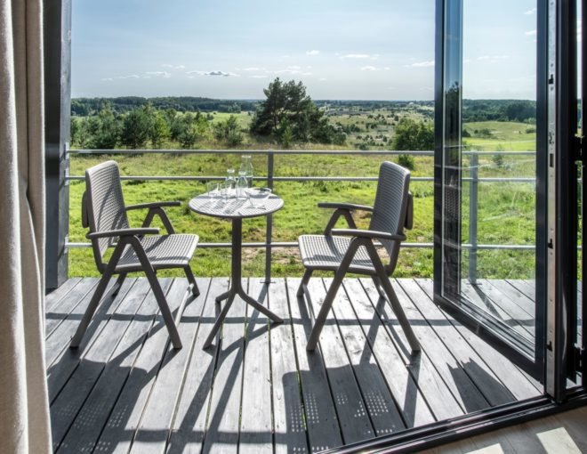 small dining table with chairs on a deck