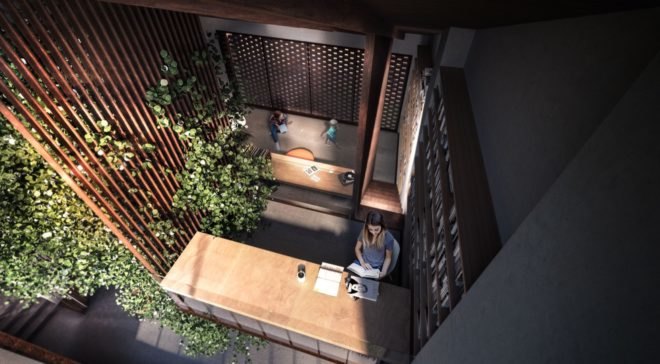 rendering of person reading a book at a wood desk surrounded by greenery
