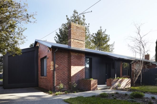 black timber and brick mid-century home
