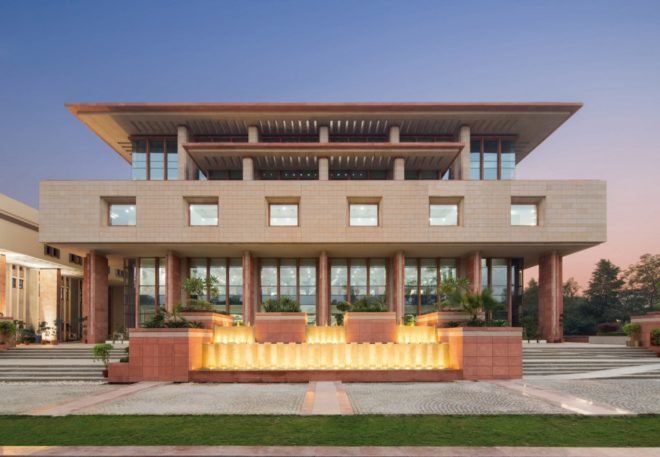 tall tan brick building with many windows