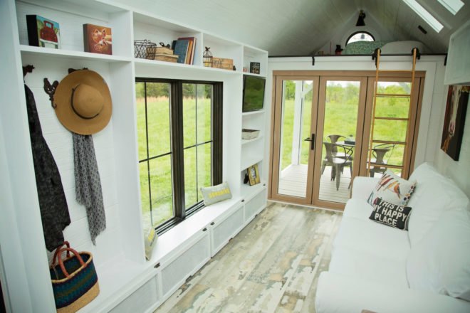 interior living space with white walls and plenty of windows