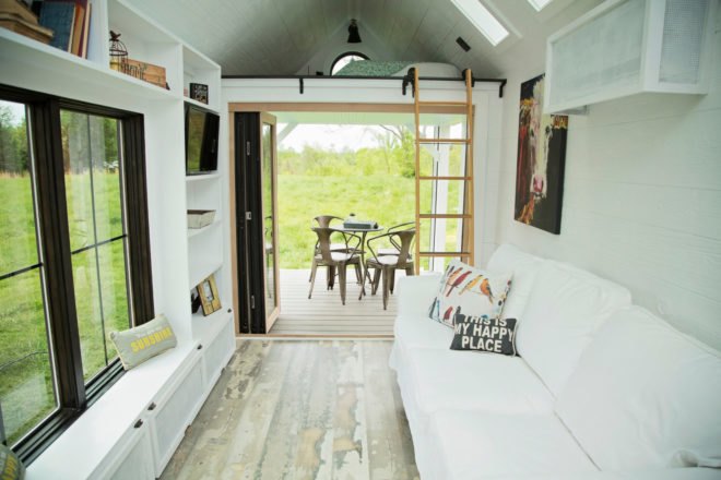 white living room leading out to covered patio