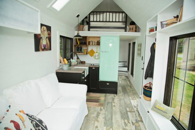kitchen with blue SMEG fridge and black cabinetry