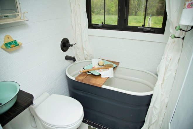 iron bathtub painted black and white