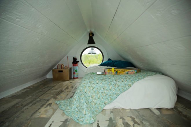 tiny room with bed on the floor