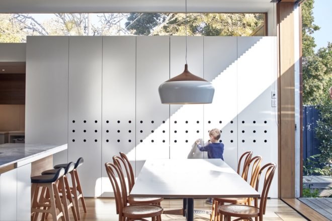 white dining table with light wood chairs