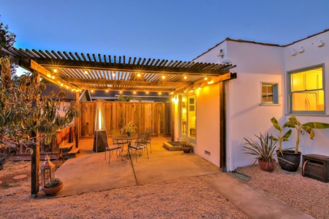 back patio of home with pergola