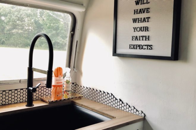 kitchen with wood countertop and large sink