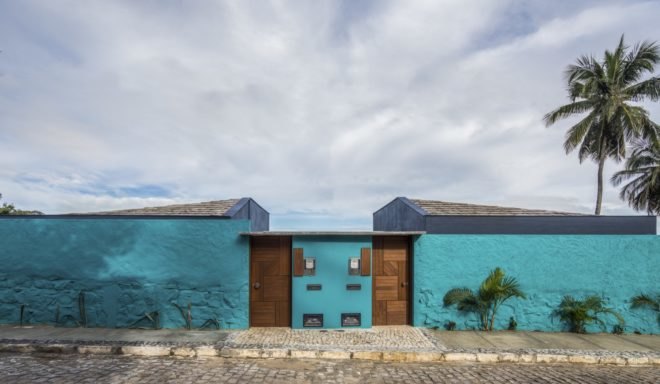 bright blue home with timber doors