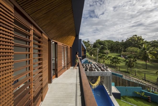 person standing on wood balcony