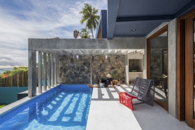 person sitting beside a pool
