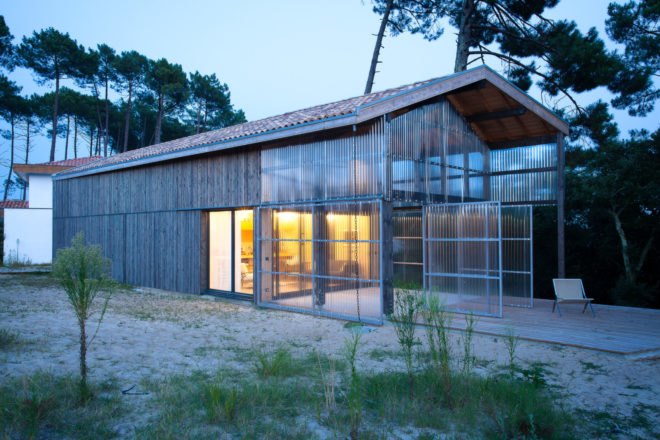 timber home with transparent front porch