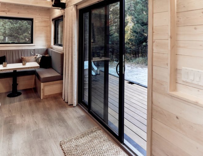 sliding glass doors leading from living area to outdoor deck