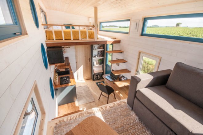 aerial view of interior with lofted living room and lofted bedroom on each end