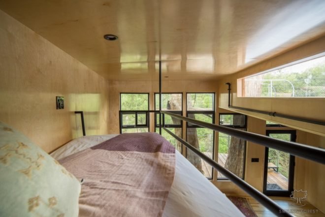 small bunk bed with railings