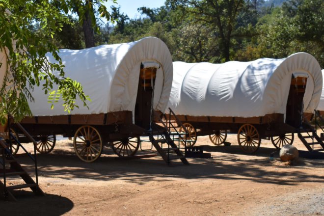 a row of covered wagons