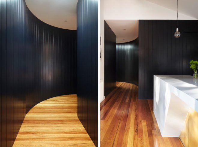 black timber-clad curving tunnel