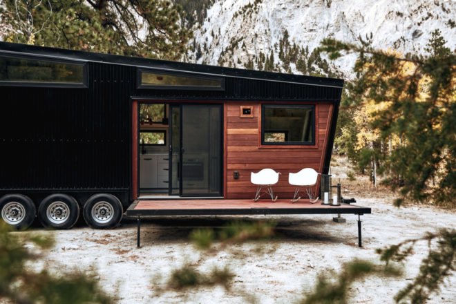 black RV with windows and slanted roof