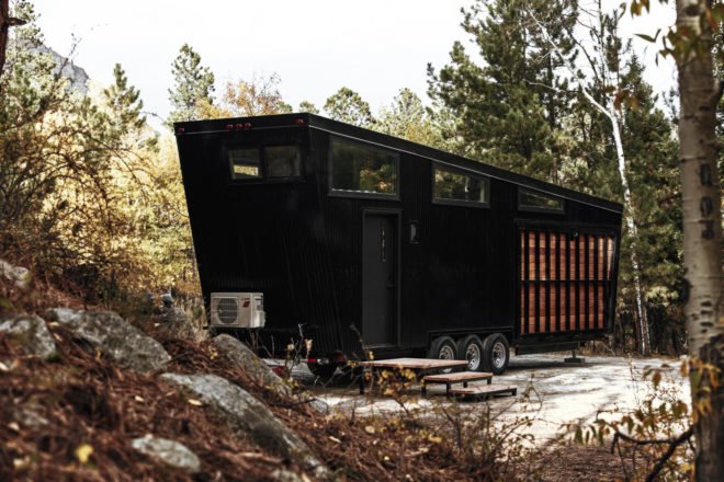 black RV with deck folded up